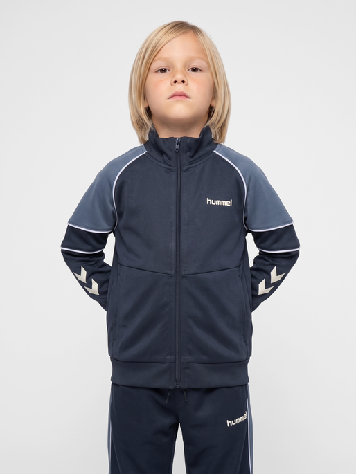 hmlJR REG POLY BLOCK ZIP JACKET, OMBRE BLUE, model