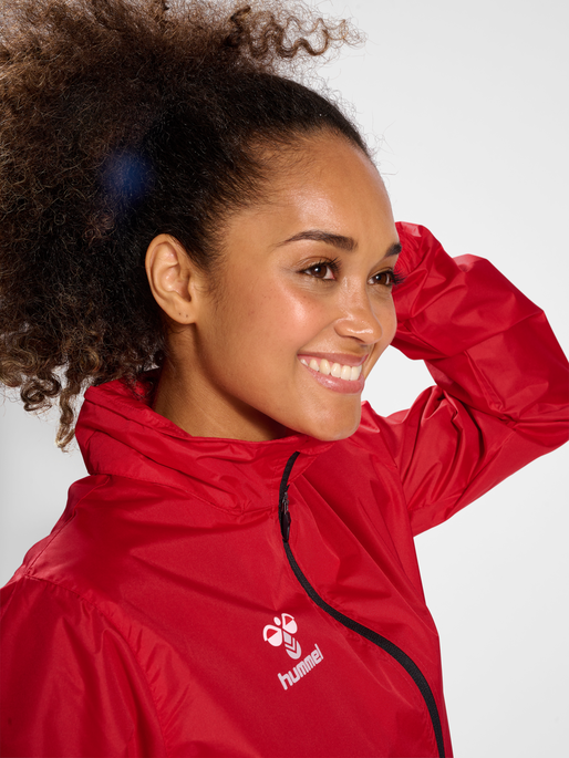 hmlCORE XK SPRAY JACKET, TRUE RED, model